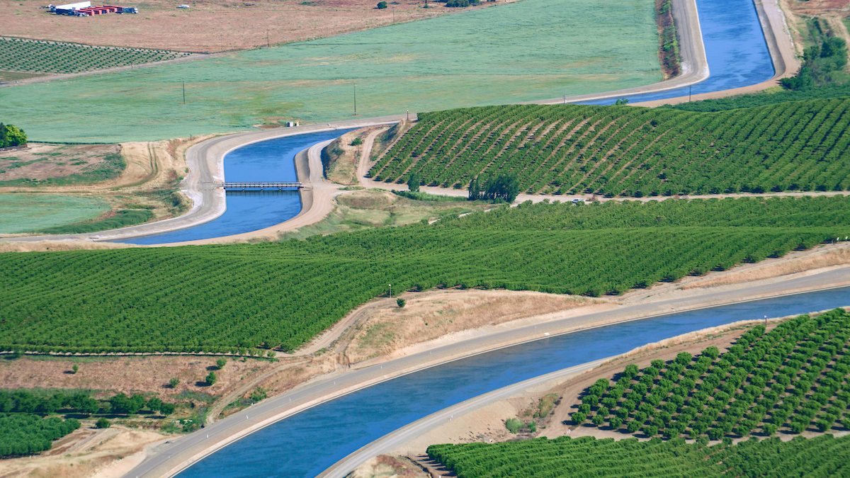 Aerial view of the California Aqueduct curving through Central Valley farmland